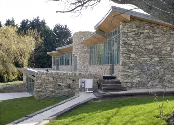 Eco-friendly Home - new expensive upmarket innovative Cotswold stone house with large expanse of glass windows and turf roof in AONB conservation area - Cotswolds - UK