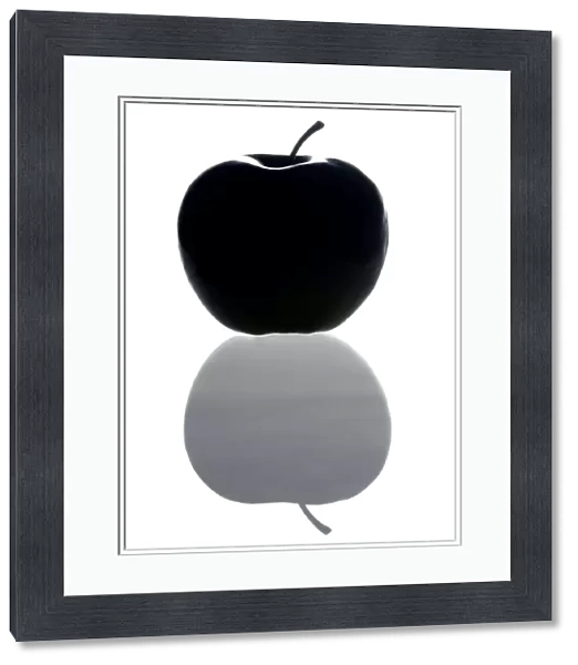 Apple. Computer image showing an apple with its shadow or reflection below it