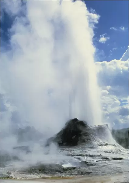 Water and steam erupting from a geyser