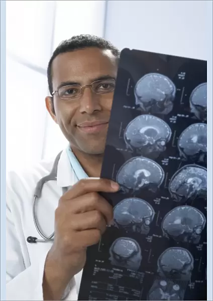 Doctor holding MRI scans