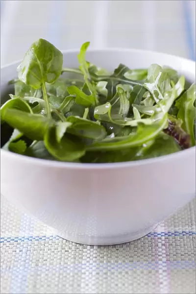 Salad covered with vinagrette. This is a dressing made