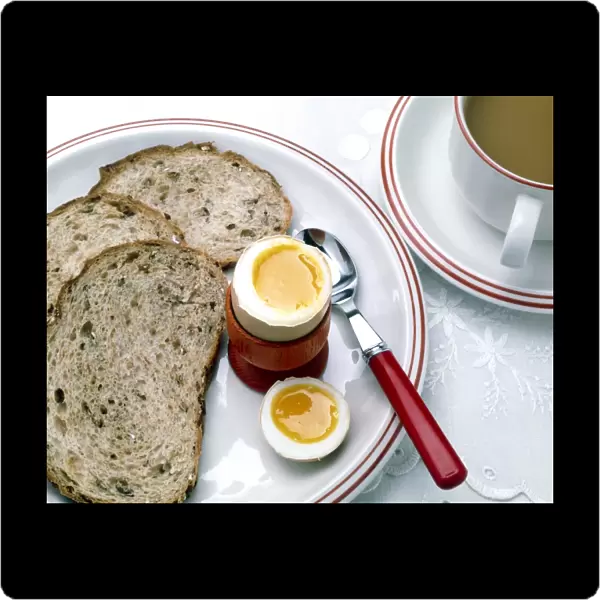 View of a healthy breakfast of egg, bread and tea