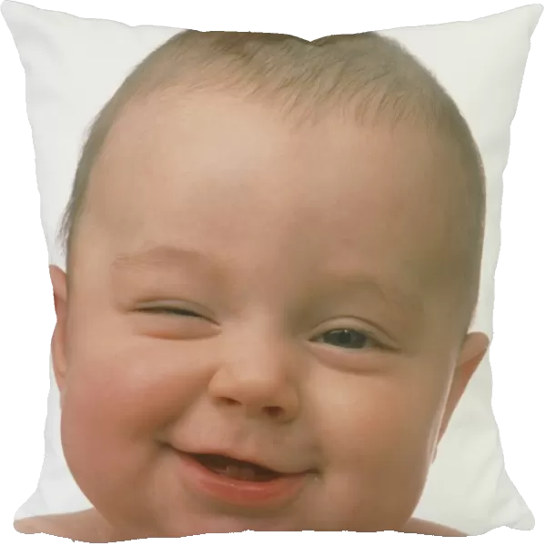 Portrait of a smiling six month old baby boy