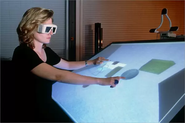 Woman using a 3-D computer-aided design system