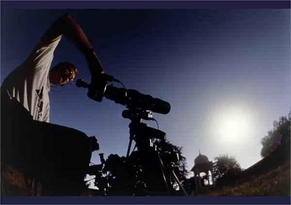 Amateur astronomer observing a solar eclipse