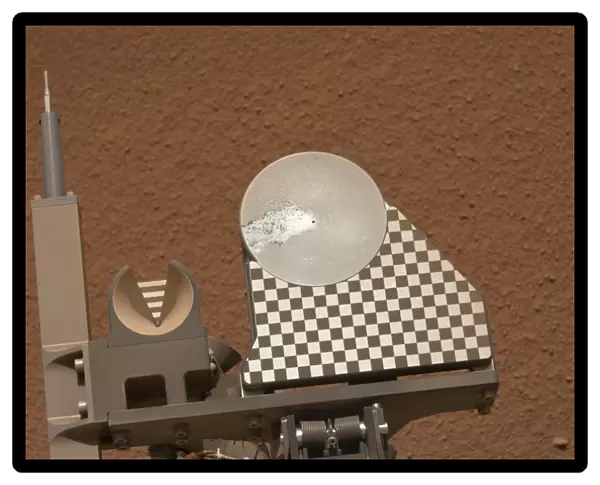 Curiosity rover collecting Martian soil C015  /  6507