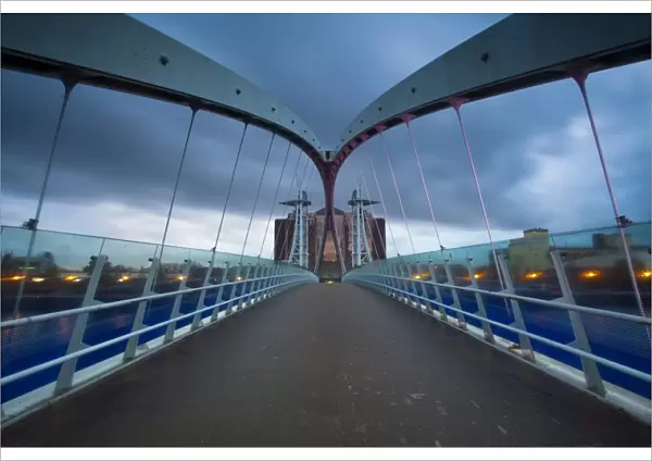 England, Greater Manchester, Salford Quays. The Lowry Bridge at dusk, located on the Salford Quays in the city of Salford near Manchester