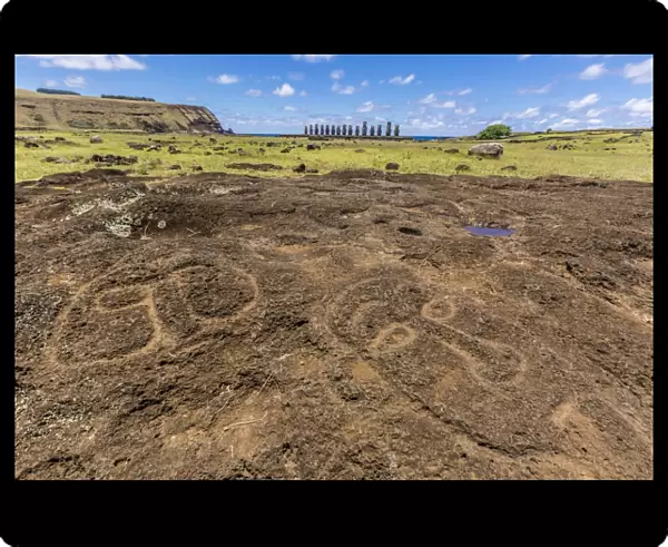 Petroglyphs carved in the lava at the 15 moai restored ceremonial site of Ahu Tongariki on Easter Island (Isla de Pascua) (Rapa Nui), UNESCO World Heritage Site, Chile, South America