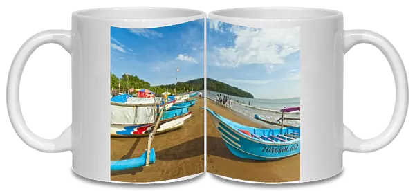Outrigger fishing boats on west beach of the isthmus at this major beach resort on the south coast, Pangandaran, Java, Indonesia, Southeast Asia, Asia