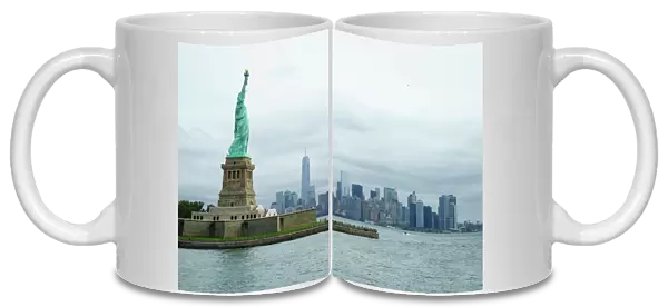Statue of Liberty with the Lower Manhattan skyline and One World Trade Center beyond, New York City, New York, United States of America, North America