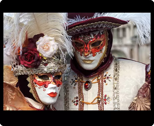 Lady and gentleman in red and white masks, Venice Carnival, Venice, Veneto, Italy, Europe