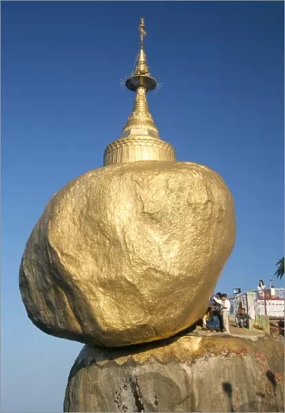 Balanced rock covered in gold leaf, major Buddhist stupa and pilgrim site
