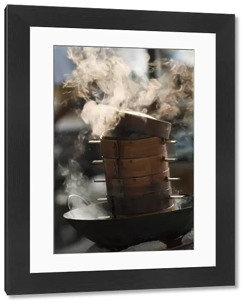 Steaming baskets on wok, Leshan, Sichuan, China, Asia