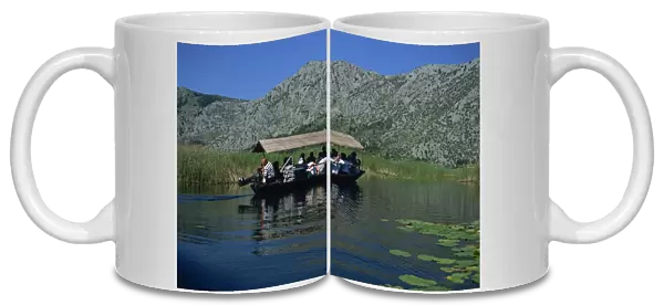 Tourists in local boats, Neretva Delta Valley, Croatia, Europe