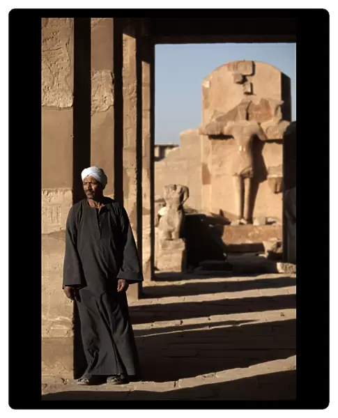 A lone figure stands amongst the Temples of Karnak, Thebes, UNESCO World Heritage Site