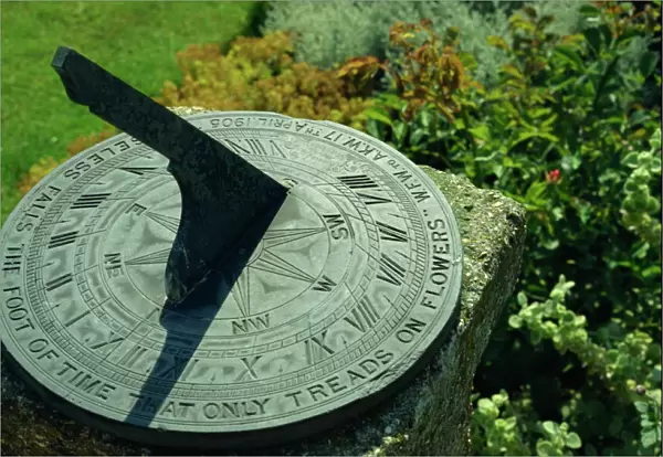 Sundial on plate of slate inscribed Noiseless falls the foot of time that only treads on flowers 1905, Little Hall, Lavenham, Suffolk, England, United