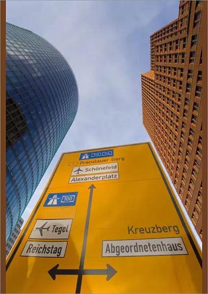 Low angle view of traffic sign and skyscrapers