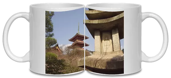 Red pagoda and stone lantern with image of Buddha
