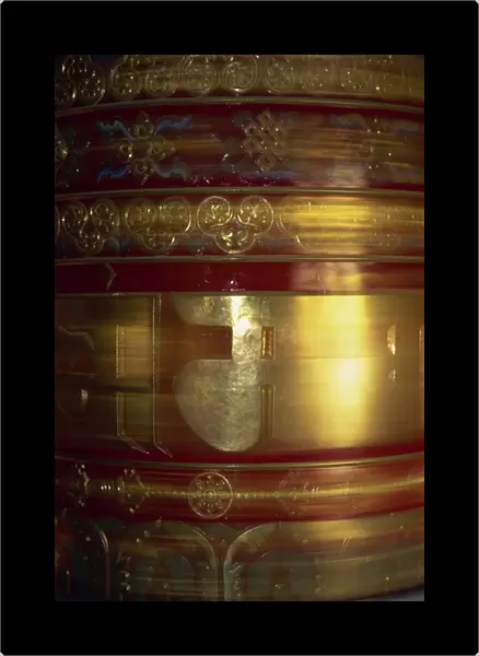 Large gold and red spinning Buddhist prayer wheels