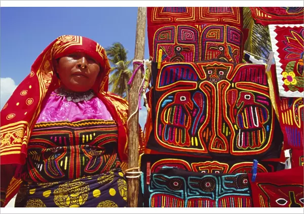 Cuna indian woman displays her molas (traditional garments)