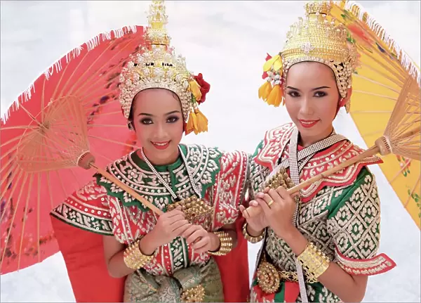 Portrait of two dancers in traditional Thai classical dance costume