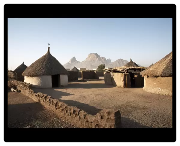 Homes lie in the shadow of Taka Mountain in the town of Kassala