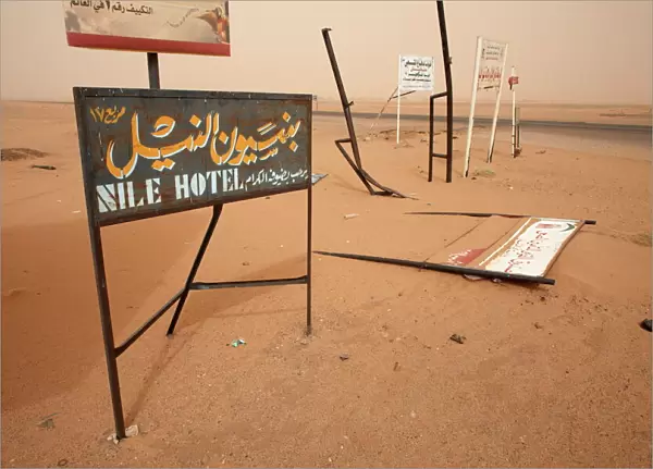 Signposts stand in the desert along the Khartoum to Atbara highway
