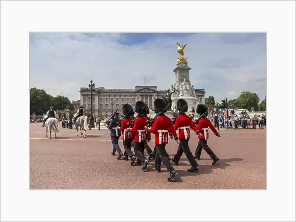 Changing the Guard at Buckingham Palace, New Guard marching, colourful spectacle