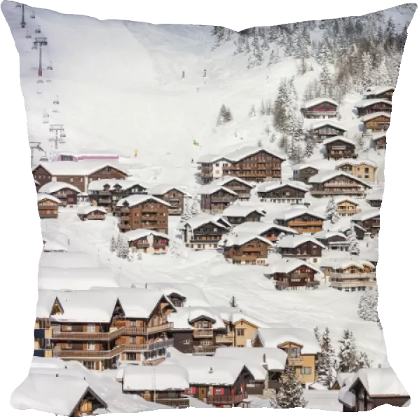 Snowy woods frame the typical alpine village and ski resort, Bettmeralp, district of Raron