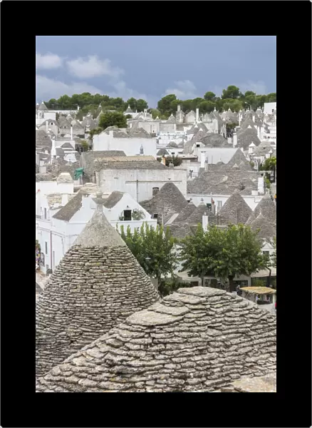 View of the typical Trulli built with dry stone with a conical roof, Alberobello