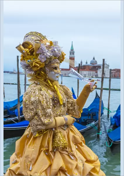 Colourful mask and costume of the Carnival of Venice, famous festival worldwide, Venice