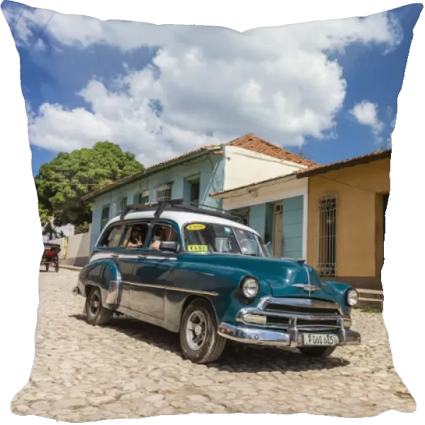 A vintage 1950s American car working as a taxi in the town of Trinidad, UNESCO World Heritage Site