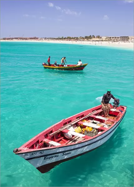 Fishermen bringing their catch of fish in fishing boats to Santa Maria, Sal Island