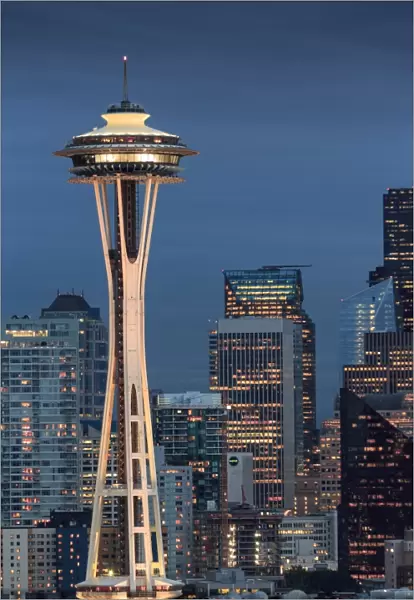 Seattle city skyline at night with illuminated office buildings and Space Needle