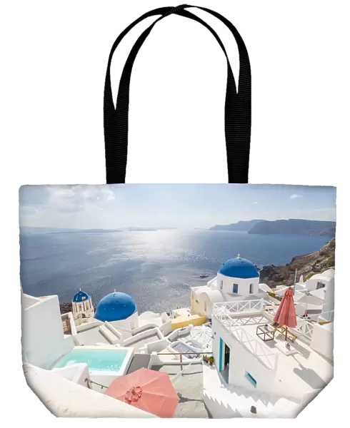 View of blue domed churches from cafe in Oia village, Santorini, Aegean Island, Cyclades Island