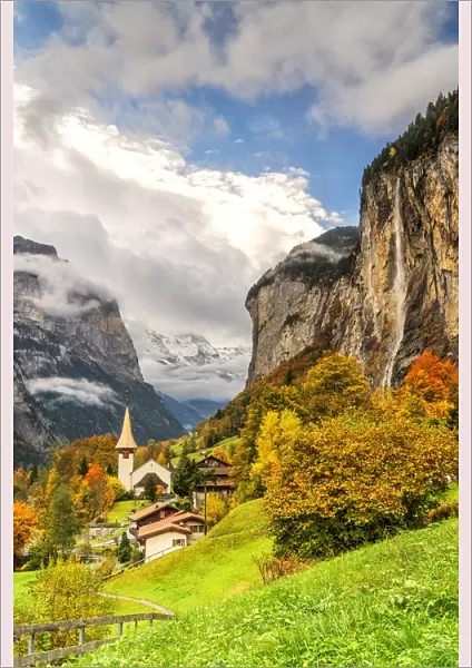 Alpine village of Lauterbrunnen and Trummelbach Falls cascade in autumn, canton of Bern