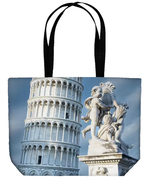High section of Pisa Leaning Tower and marble statues of fountain