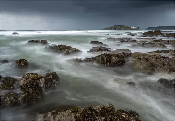Stormy conditions on the rocky Bantham coast in autumn, looking across to Burgh Island