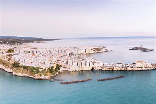 Aerial view of the white buildings of Vieste at sunrise, Foggia province