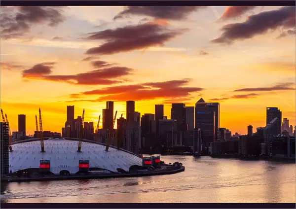 Sunset behind Canary Wharf, Docklands, and O2 Arena, London, England, United Kingdom, Europe