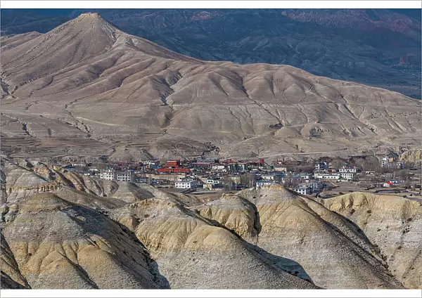 Lo Manthang, capital of Upper Mustang, viewed from a distance amidst a barren desertic landscape, Kingdom of Mustang, Himalayas, Nepal, Asia