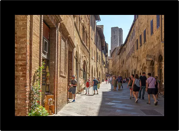 View of towers from narrow street in San Gimignano, San Gimignano, UNESCO World Heritage Site, Province of Siena, Tuscany, Italy, Europe