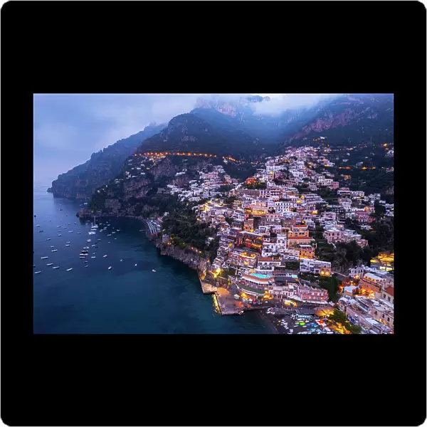 The illuminated and pretty village of Positano at dawn, aerial view, Amalfi Coast, UNESCO World Heritage Site, Campania region, Italy, Europe