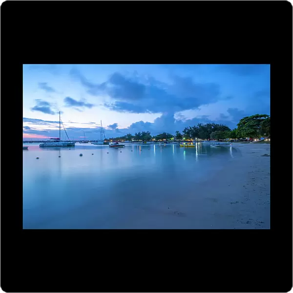 View of boats on the water in Grand Bay at dusk, Mauritius, Indian Ocean, Africa