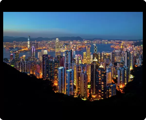 View over Hong Kong from Victoria Peak, the illuminated skyline of Central sits below The Peak