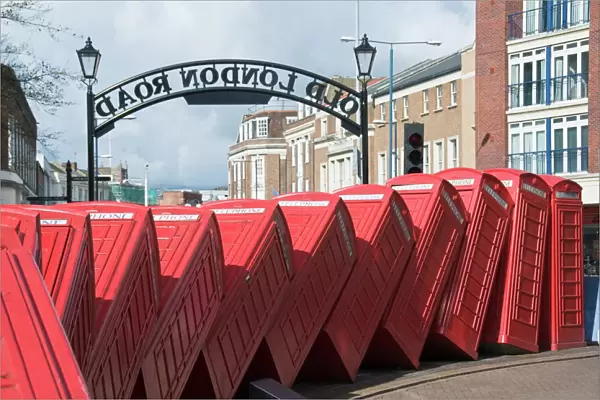 Red telephone box sculpture entitled Out of Order by David Mach, Kingston upon Thames