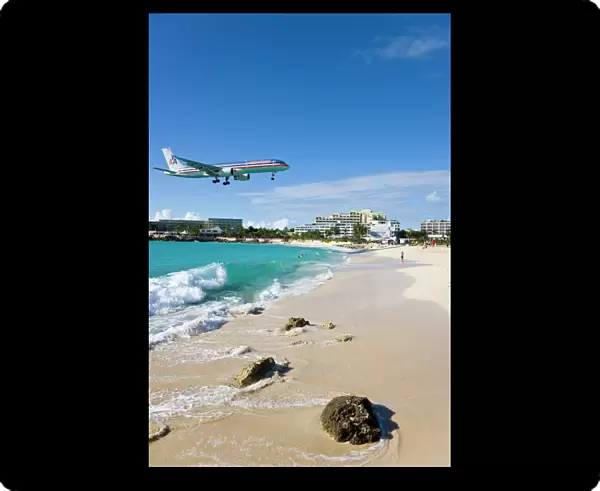 Beach at Maho Bay and low flying aircraft approaching the runway of Princess Juliana International airport, St. Martin (St. Maarten), Leeward Islands, West Indies, Caribbean
