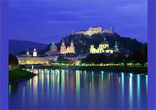 City and castle at night from the river, Salzburg, Austria, Europe