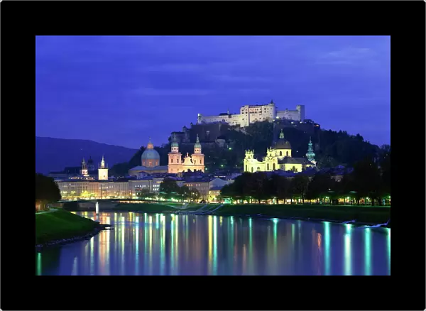 City and castle at night from the river, Salzburg, Austria, Europe
