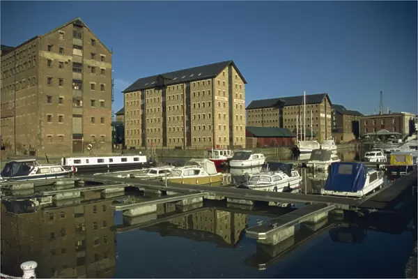 Warehouses and boats in marina at docks, Gloucester, Gloucestershire, England